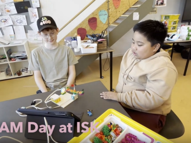 Two students engaged in STEAM activities